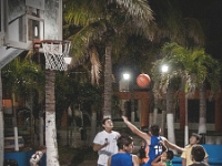 Basketball  Local young'uns in an after dark pickup game.